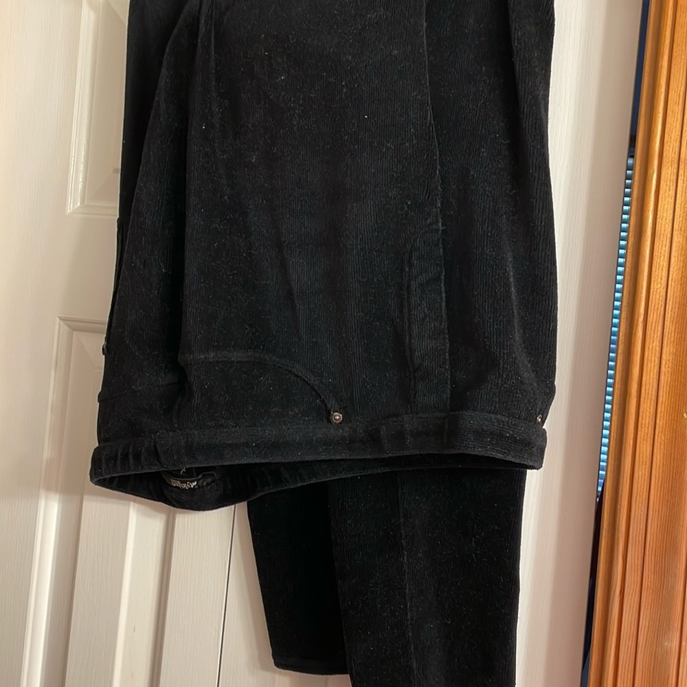 Black corduroy stretch, worn but in good shape no tears no holes